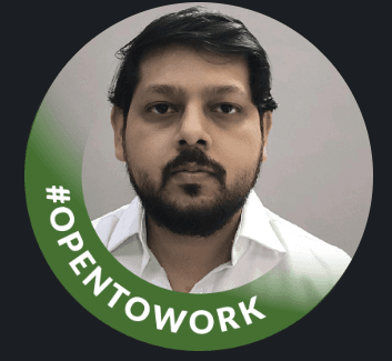 person peeping from behind laptop